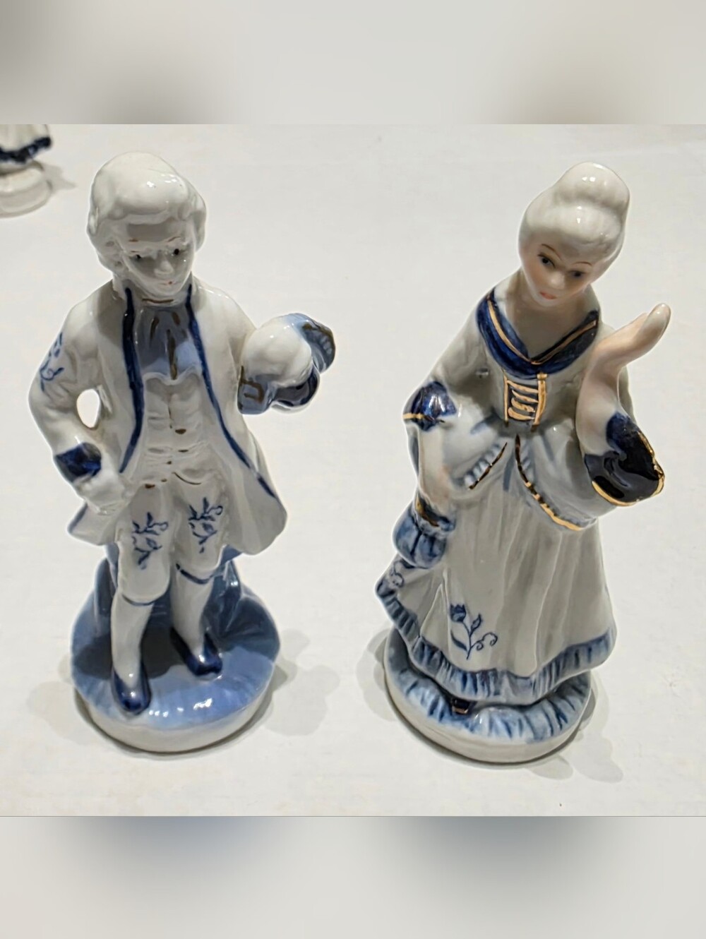 Vintage Porcelain Couple Figurines in White and Blue with Gold Trim